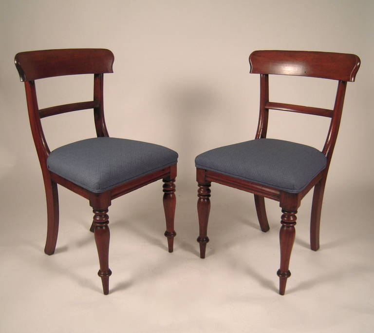 A pair of well proportioned English Regency period klismos-form mahogany chairs, circa 1810-1820. Structurally sound and comfortable.