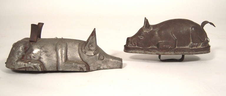 Two rare late 19th century tin pig-form molds for terrine or aspic.

Dimensions:

Top:

H: 5 1/2