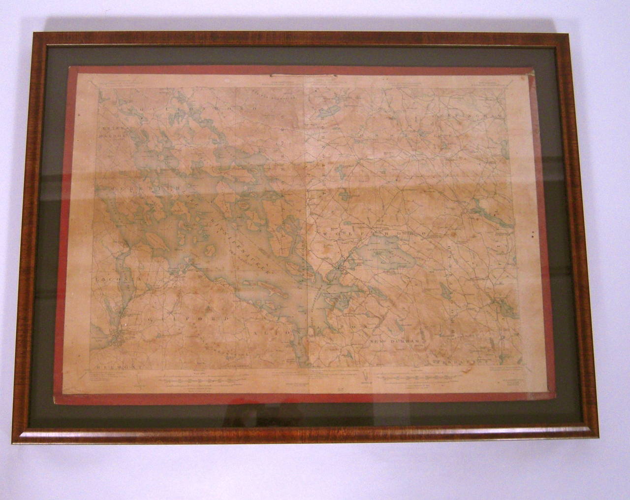A framed, very detailed map of lake Winnipesaukee, NH and surrounding areas (the 'Winnipesaukee Quadrangle or Wolfeboro Triangle'), published by the United States Department of the Interior Geological Survey, circa 1925, printed on heavy card stock
