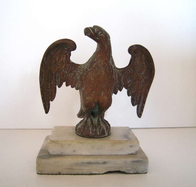 A well modeled and nicely patinated sculpture of a bald American Eagle, likely a flag topper, mounted on a stepped marble plinth. American, circa 1890.

Provenance: Stillington Hall, decorated by Henry Sleeper in the 1920s.

Measures: Height: 7