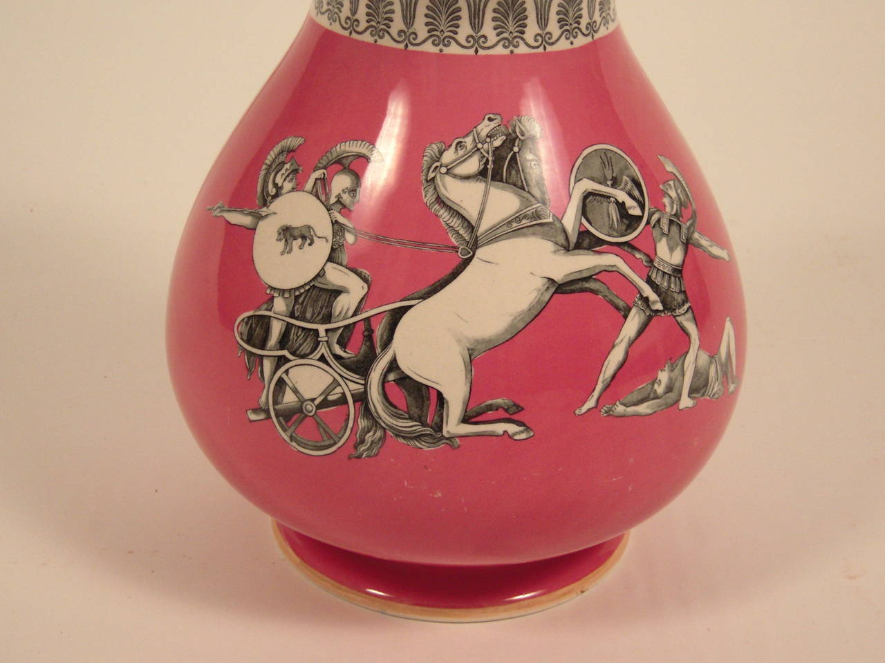 A large pink 19th century Ridgeway Staffordshire vase decorated with black and white neoclassical scenes below a band of stylized anthemion (honeysuckle), the light orange colored everted rim decorated with a black and white Greek key band on the