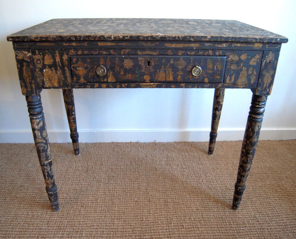 An unusual ebonized and decoupage decorated pine adjustable one drawer architect's table, probably New England, early 19th century, the top hinged at front and back to allow for adjustment of the height and angle of the working surface, black