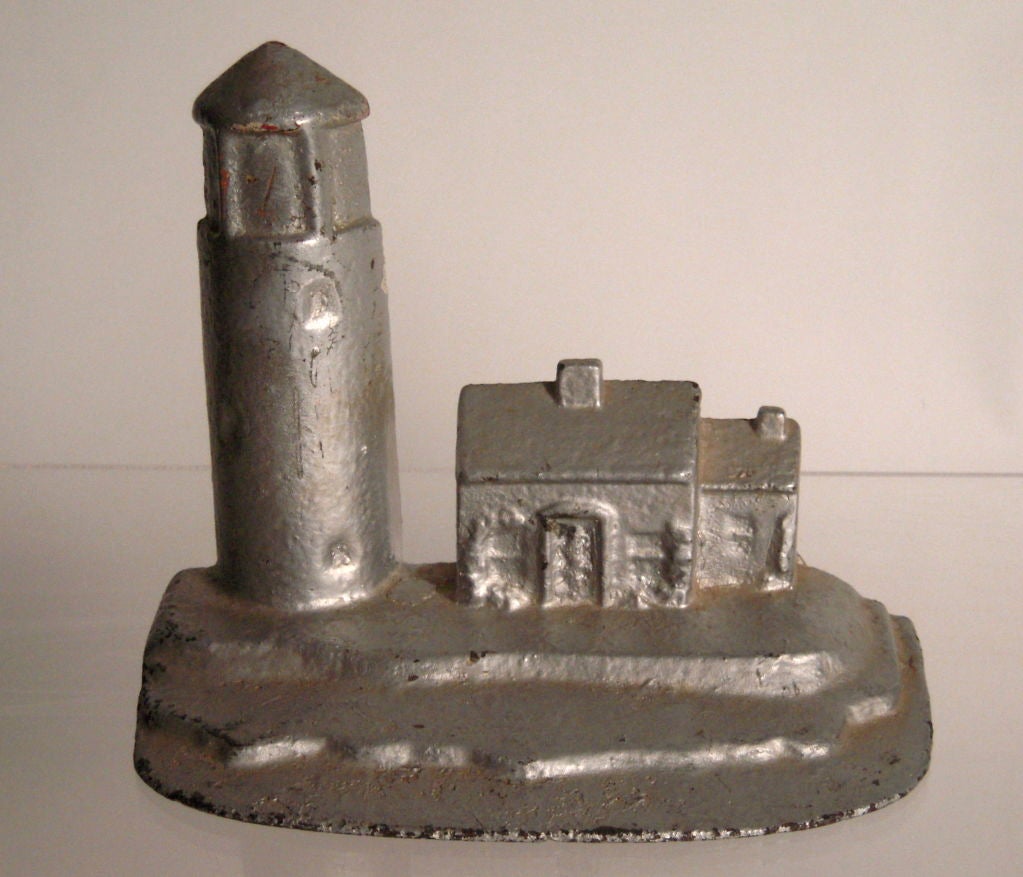 American Pair of Cast Iron Lighthouse Doorstops