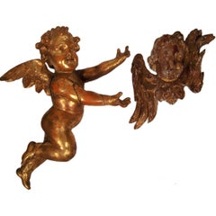 A CARVED GILTWOOD CHERUB