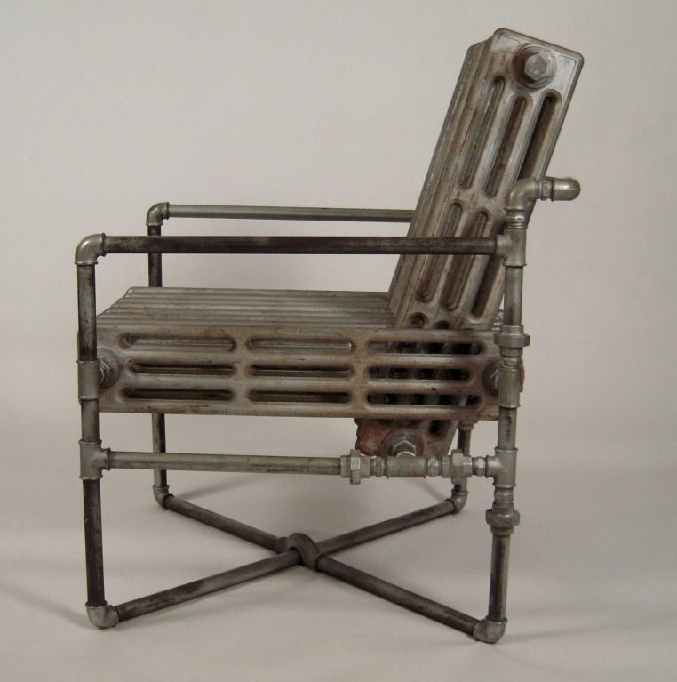 An armachair ingeniously made from 2 interlocking  turn of the century cast iron radiators.<br />
Despite the materials this chair is made from, it is surprisingly comfortable. The proportions and angle of the back and seat are well designed. For