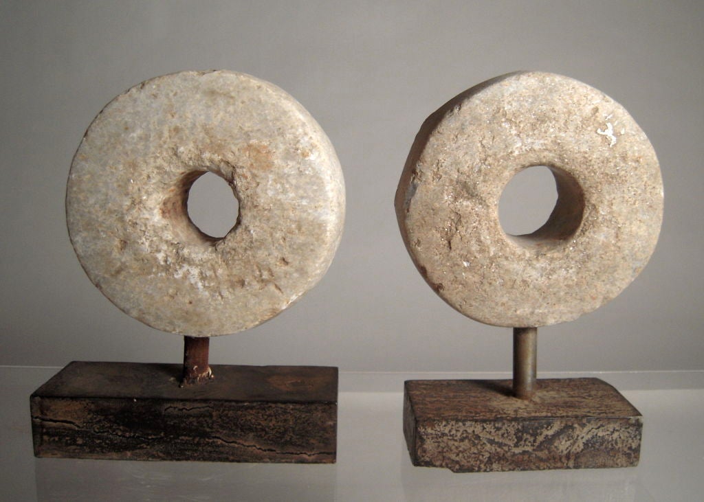 American Two Carved and Mounted Mill Stones