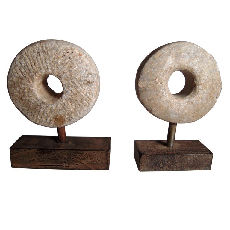 Two Carved and Mounted Mill Stones