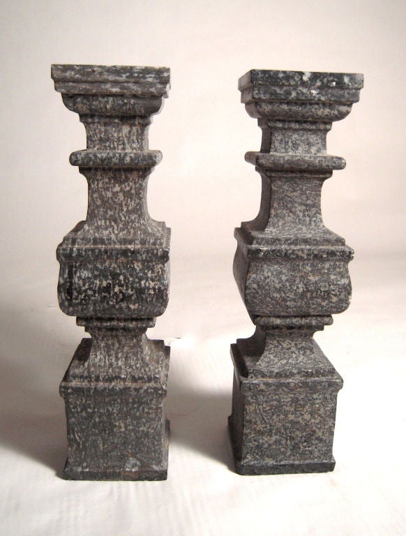 A pair of fine 18th century hand carved unpolished Swiss grey marble architectural elements from a church balustrade in the Ticino region of southern Switzerland. Sculptural and heavy, these would make excellent lamp bases.