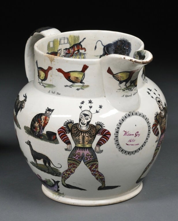 A large and unusual hand-painted, transfer-decorated Staffordshire pottery pitcher by Elsmore & Forster, Tunstall, England, mid-19th century, the rim and sides decorated overall  with exotic and domestic animals and figures, a round reserve under