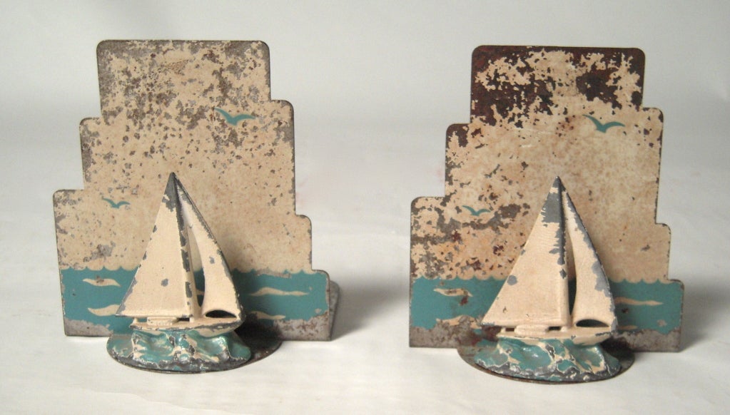 A pair of charming American  Art Deco period painted metal sailboat bookends.