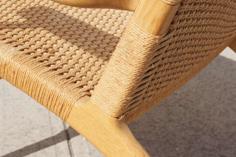 Designed in 1950 by Hans Wegner, this lovely armchair is simply but beautifully constructed of oak and paper cord.