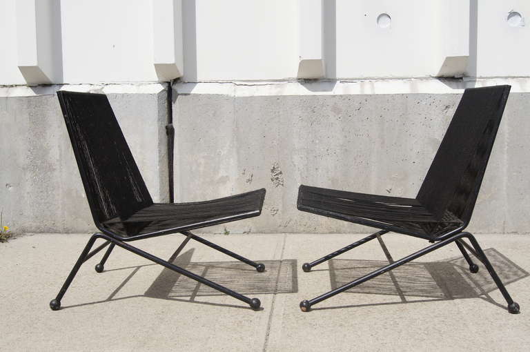 Allan Gould created these eye-catching Bow Chairs by wrapping yacht cord around a black steel frame, resulting in a soft seat and back and strong lines.