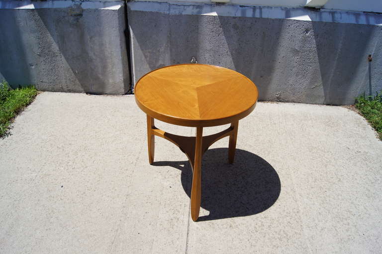 This rare occasional table, which was designed in 1957 by Edward Wormley for Dunbar, is constructed of mahogany and features three gently curved legs and round top.
