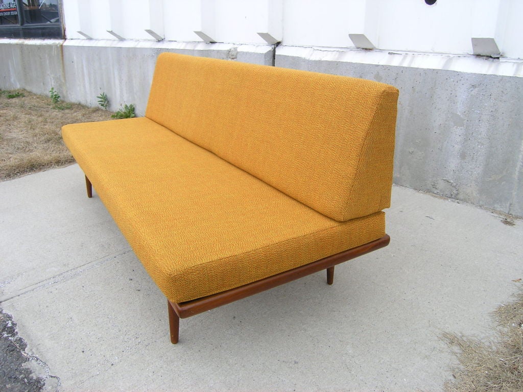 This day bed designed by Peter Hvidt and Olga Molgaard-Nielson for France & Sons has been newly reupholstered with beautiful never-used vintage textile.
