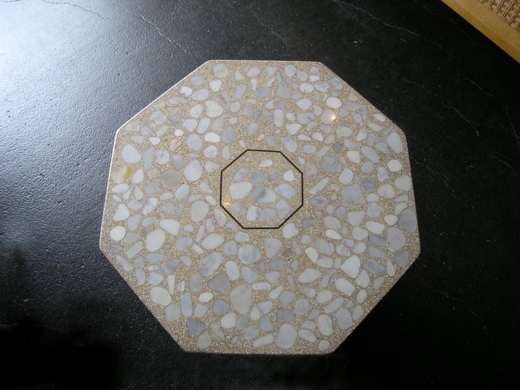 This beautiful side table has a unique travertine composite top with marble inlays.