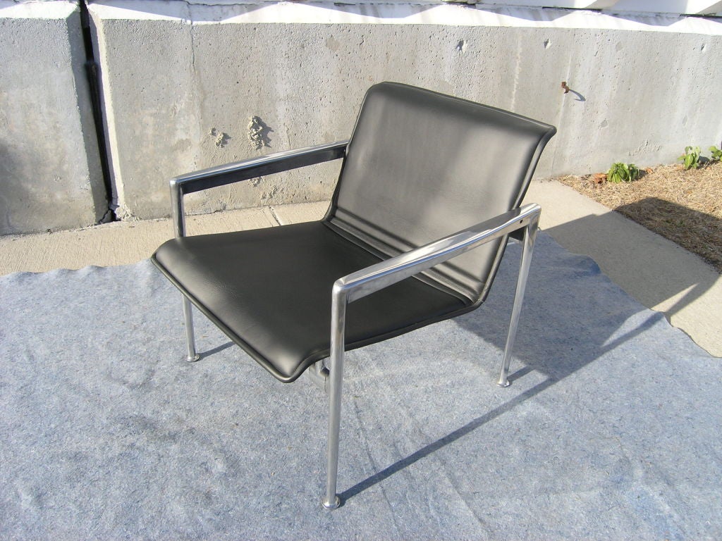 From Richard Schultz's collection for Knoll known widely as the 1966 Collection, the clean lines of the 25L lounge chair emphasize its understated design. A slender rectilinear frame in polished aluminum holds a comfortable black leather seat.