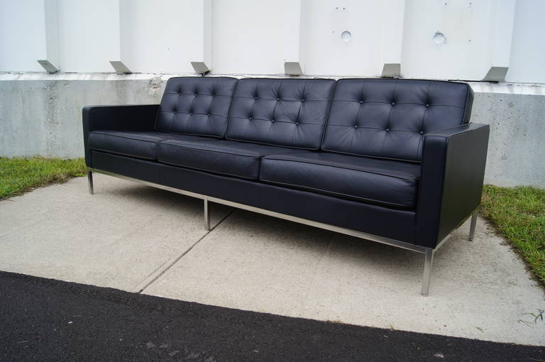 This classic sofa, designed by Florence Knoll in 1954, is upholstered in deep blue Sabrina leather over a slender steel frame.