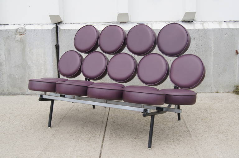 Designed by George Nelson and Irvining Harper and manufactured by Herman Miller, the iconic Marshmallow Sofa was first introduced in 1956 and has remained a staple of modern design. This cheerful example is upholstered aubergine leather.