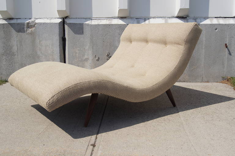 Designed by Adrian Pearsall, this chaise lounge, which is wide enough to accommodate two people, feature a sleek and comfortable S-curve shape. It has been newly reupholstered.