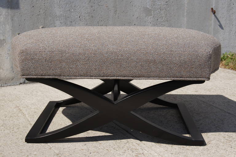 This small bench by designer Angelo Donghia offers a comfortable seat over an elegant X-shaped ebonized wood base. It has been reupholstered in Knoll's Ferry textile in Warren.