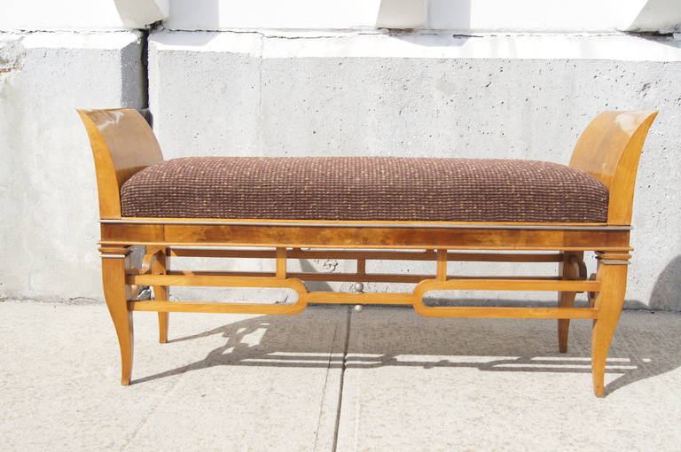 Attributed to Tomaso Buzzi, an associate of Gio Ponti, this walnut bench was made in Italy in the 1930s. It is an excellent example of Italian art deco design. The walnut burl is inset with metalwork trim and the nubby upholstery of the seat