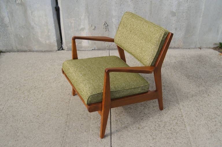 This elegant armchair, model U-430, by Jens Risom features a walnut frame with a low profile. Originally 