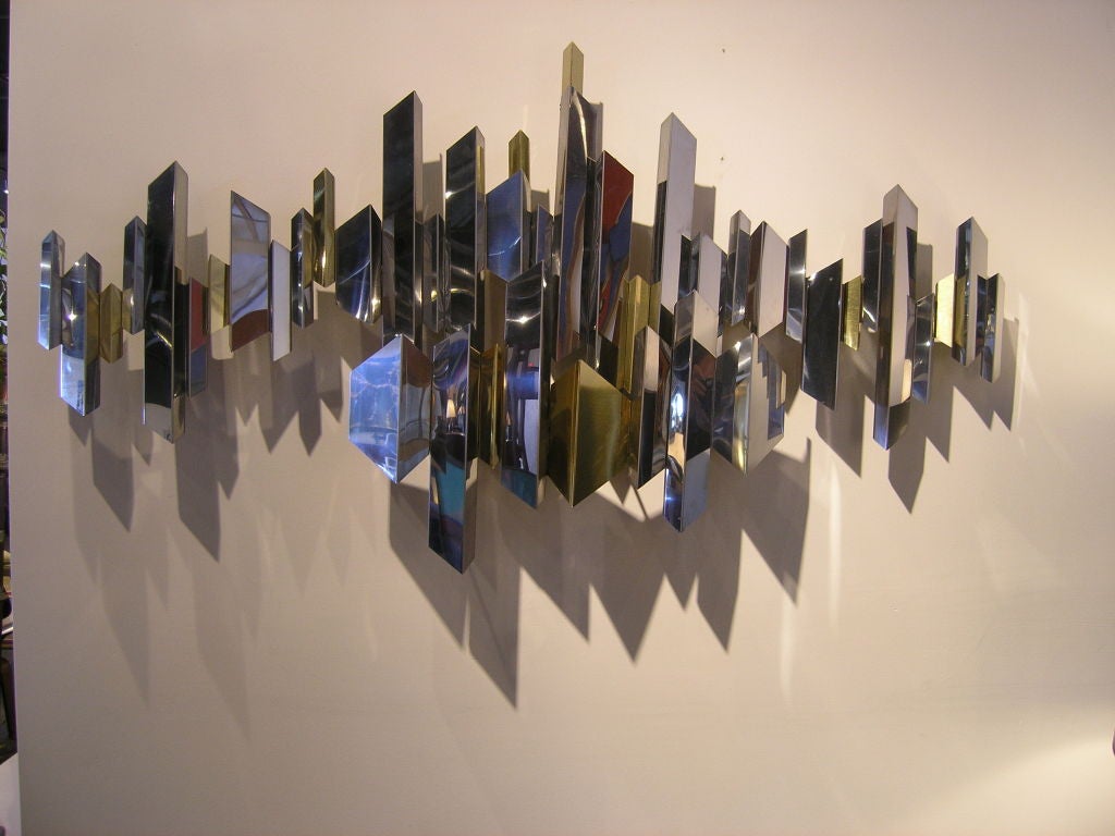 Geometric wall sculpture in brass and chrome by Curtis Jere.

One available.