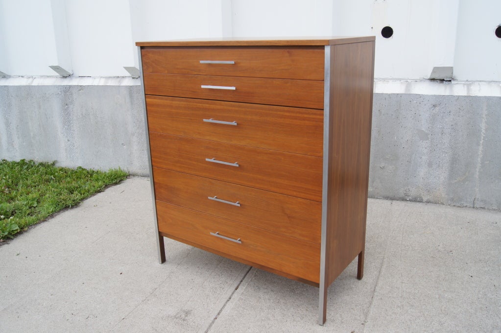 Walnut dresser by Paul McCobb with two shallow drawers and four deep drawers. Features aluminum drawer pulls and trim.