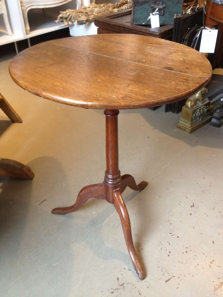 A fine Oak flip top pedestal table with tripod base. Original hardware. 