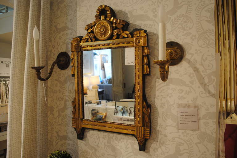 19th century ribbon carved giltwood mirror.