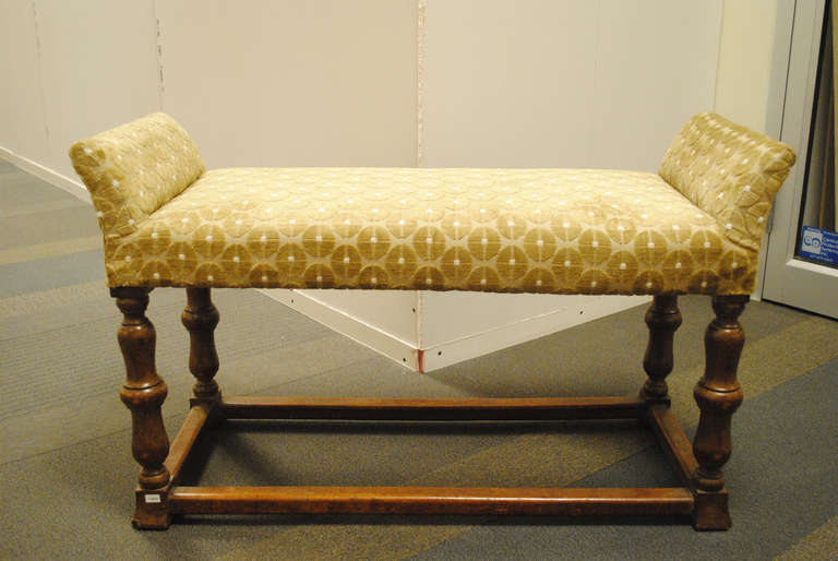 English upholstered wooden bench.