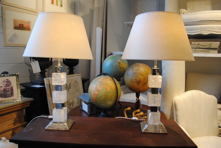 A stunning pair of square cut rock crystal table lamps. Featuring a nickel finish and two bulb capacity [each]. Handmade in France.