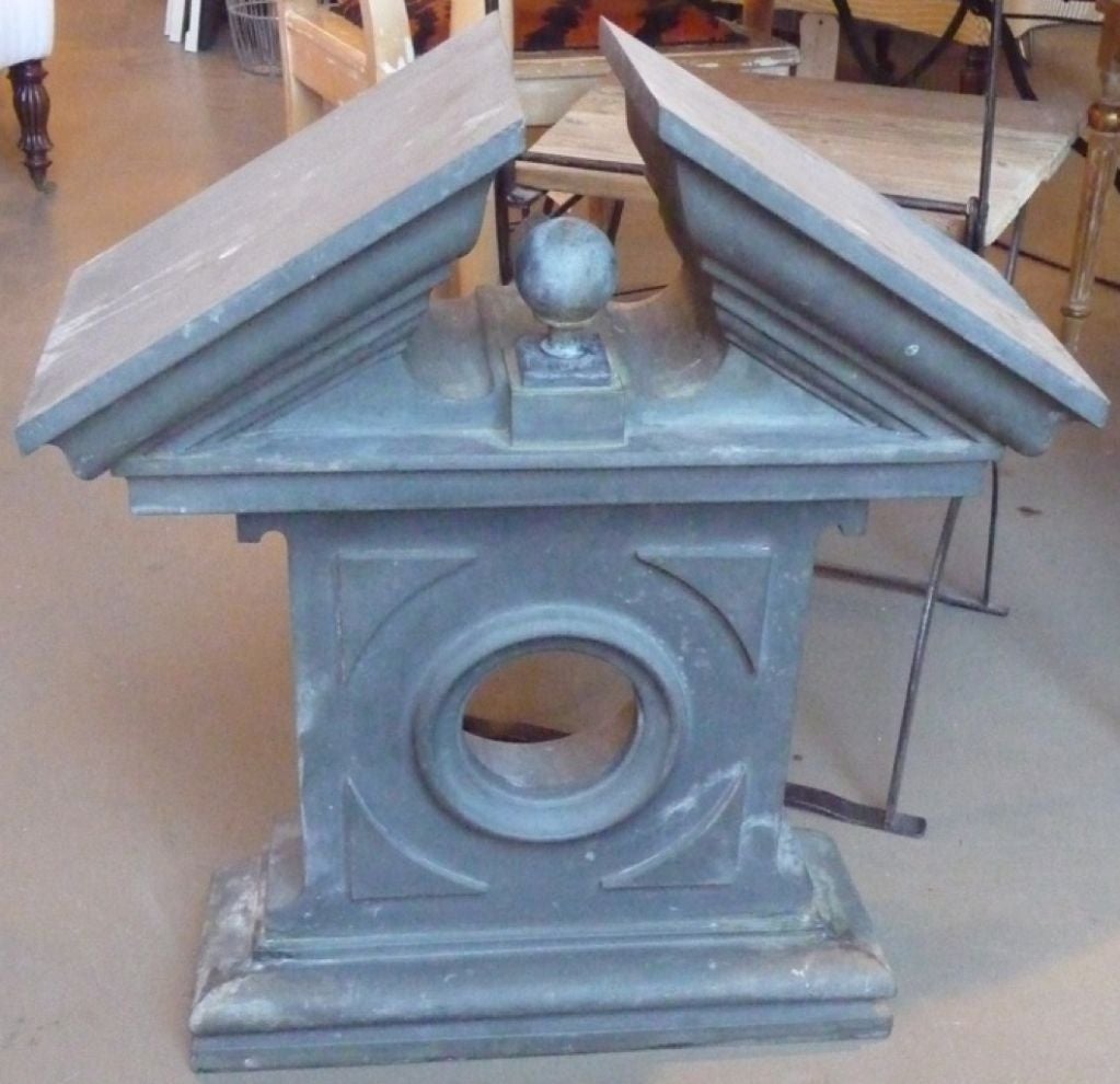 Wall-mounted decorative zinc pediment from the 19th century.