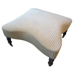 Ottoman with turned legs