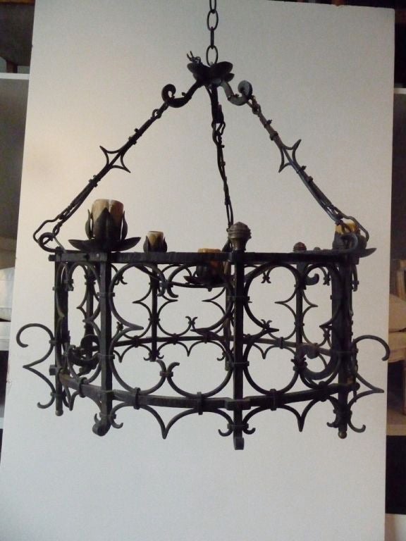 A circular French wrought iron chandelier, beautiful patina.
