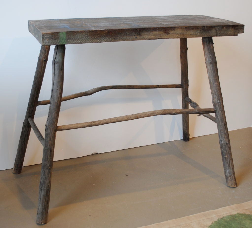 Adirondack twig console table with rustic old painted top.
  