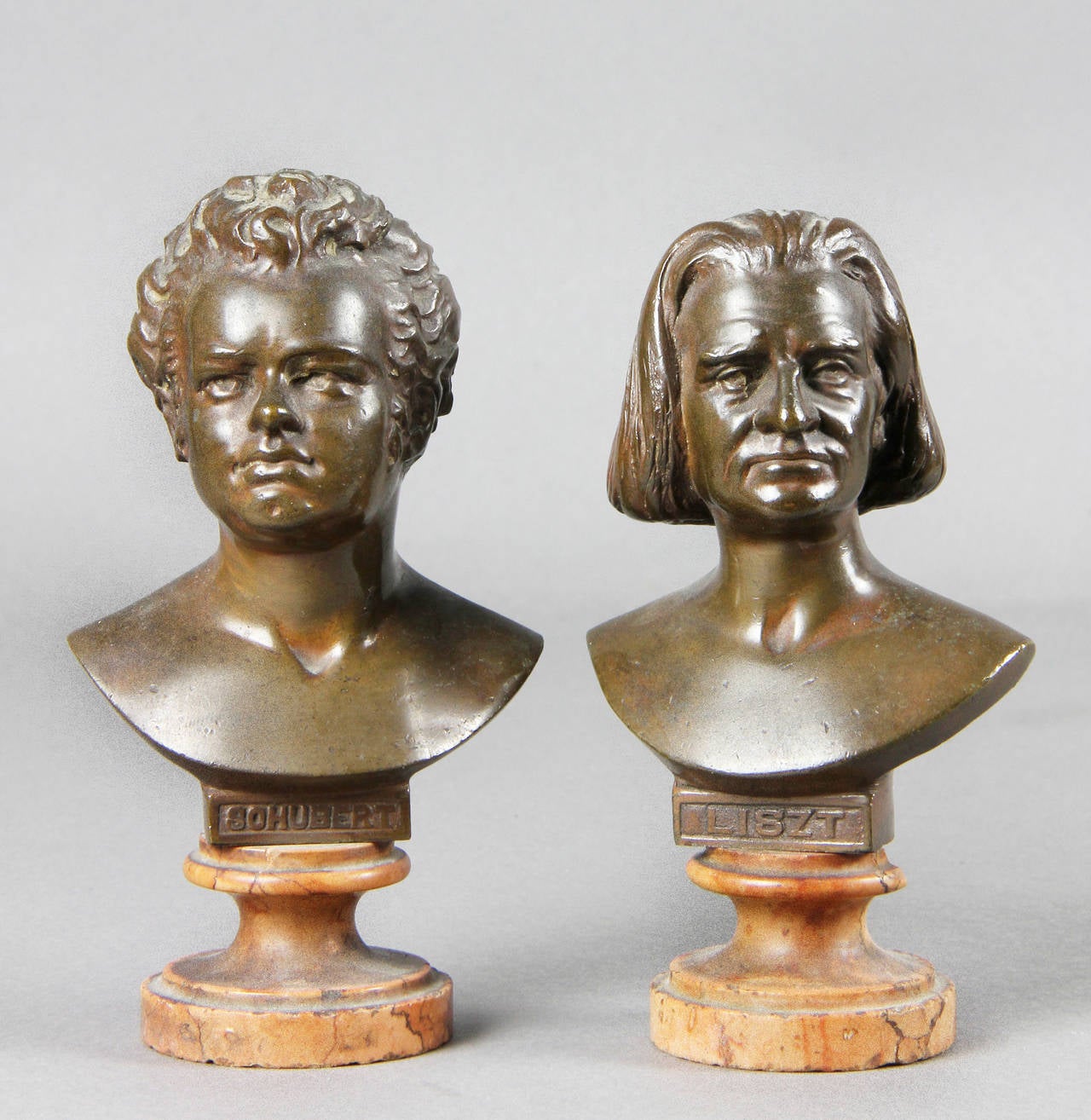 The largest four with Rosso Antico bases depicting Mozart, Haydn, Gluck and Beethoven , another medium size of Listz, then five with pink travertine bases of Gounod, Verdi, Liszt, Haendel, Schubert. Three bases with chips.
