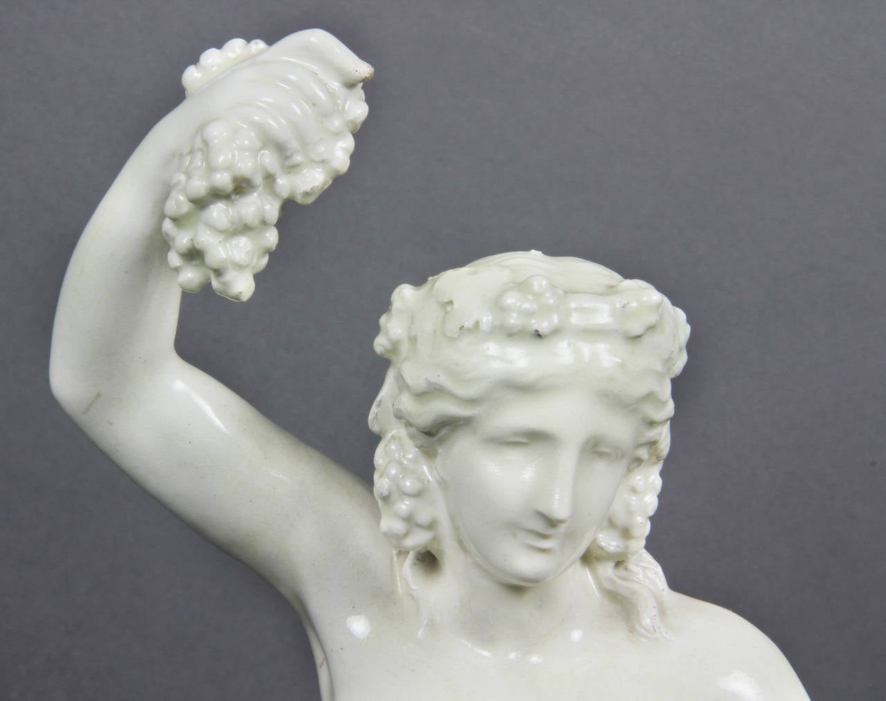 Neoclassical Creamware Figure of Bacchus with a Winged Boy