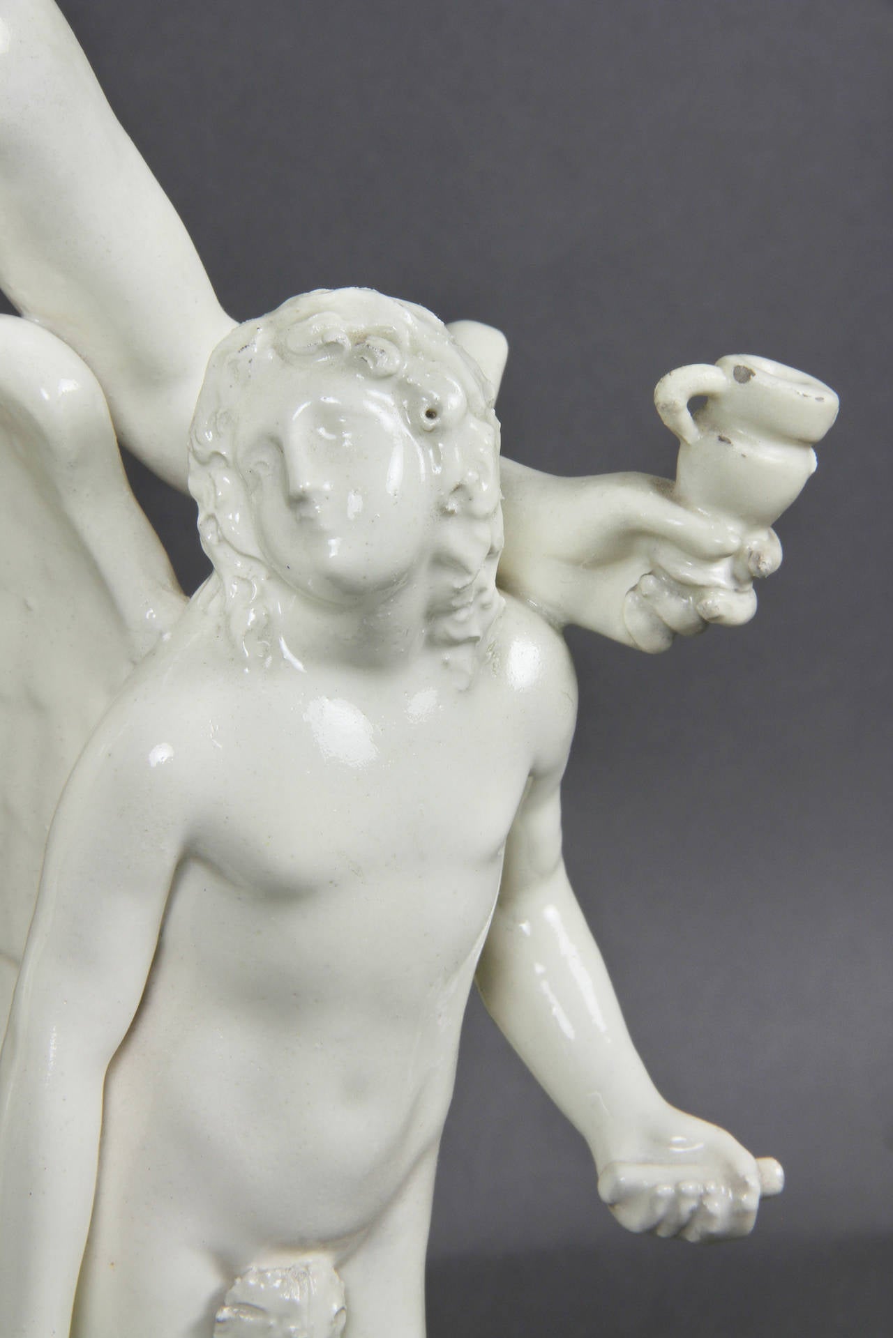European Creamware Figure of Bacchus with a Winged Boy