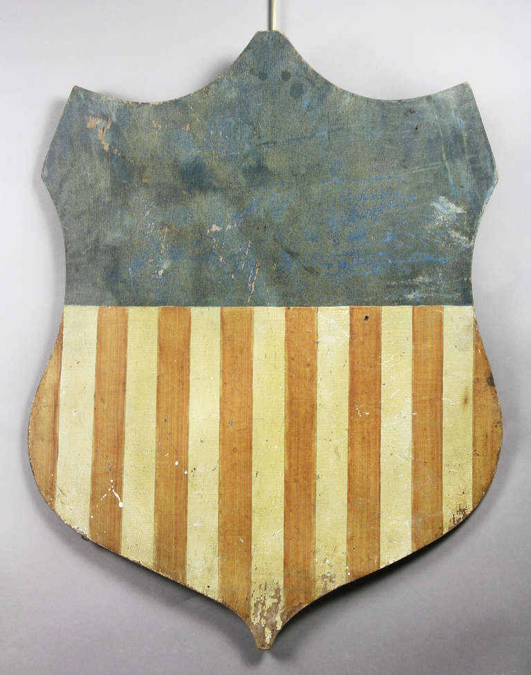Shield shape with American flag colors.