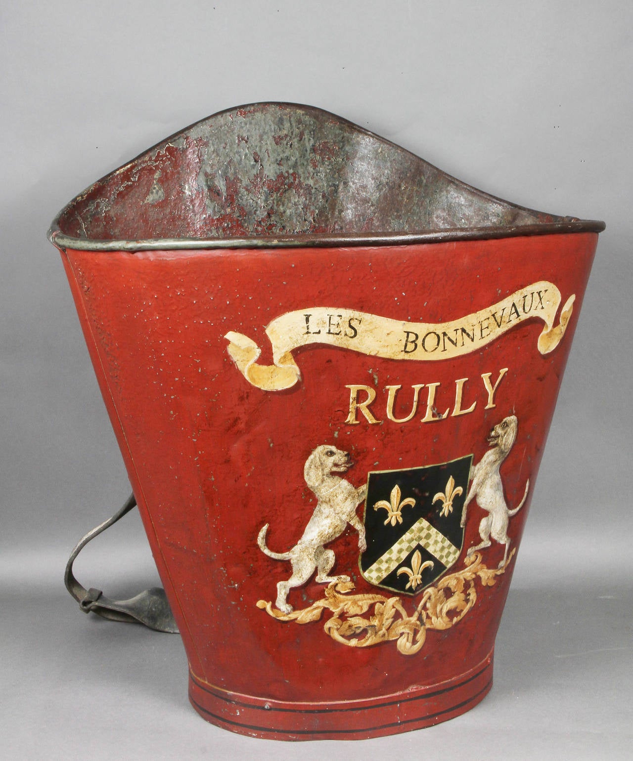 Red painted with the Rully family crest.