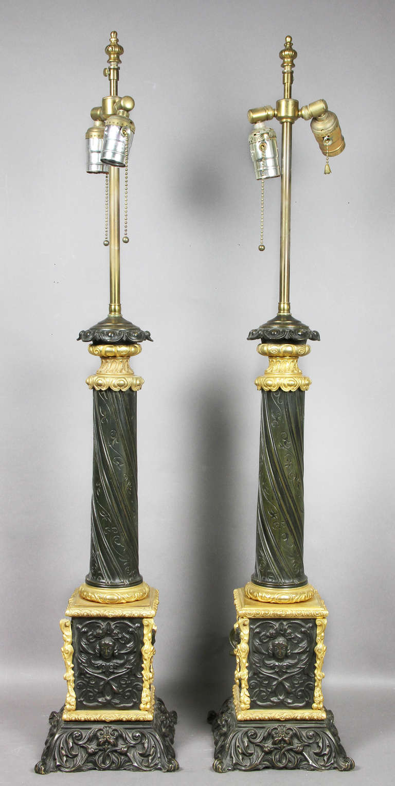 Pair of Napoleon III bronze and ormolu table lamps columnar form.