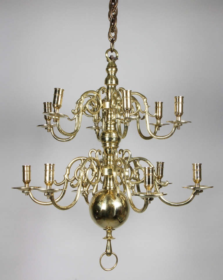 Turned support with two tiers of six arms terminating with a ball and ring.