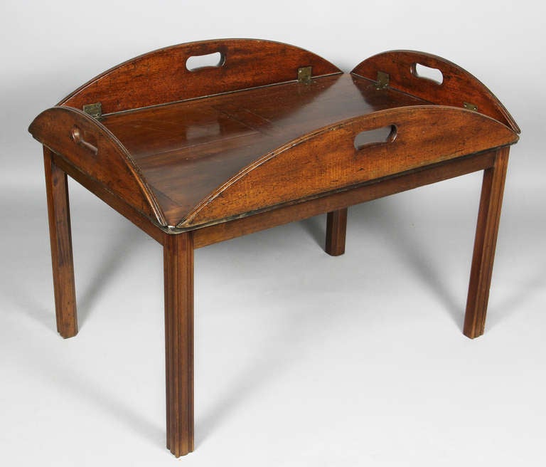 Oval top with hinged folding edges , raised on square molded legs.