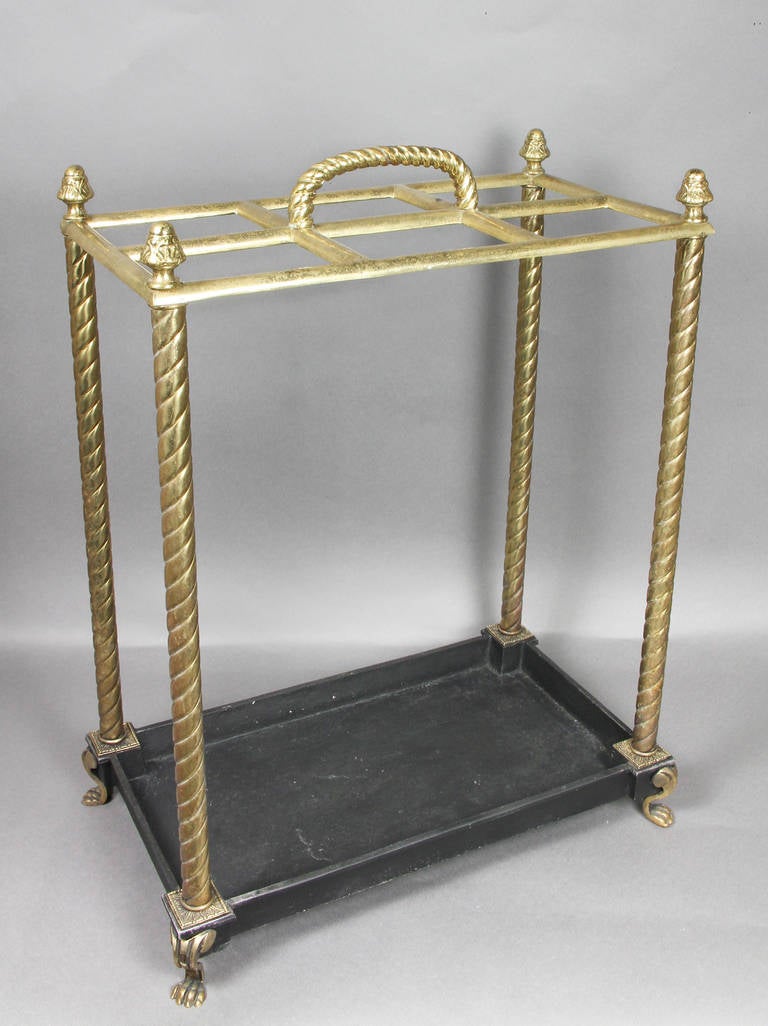 Rectangular with six compartments, brass rope twist handle and supports, black painted tray, paw feet.