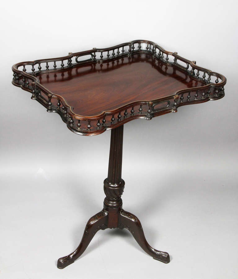 Tray top with brass inlay on a turned fluted and carved support , carved tripartite legs , pad feet.