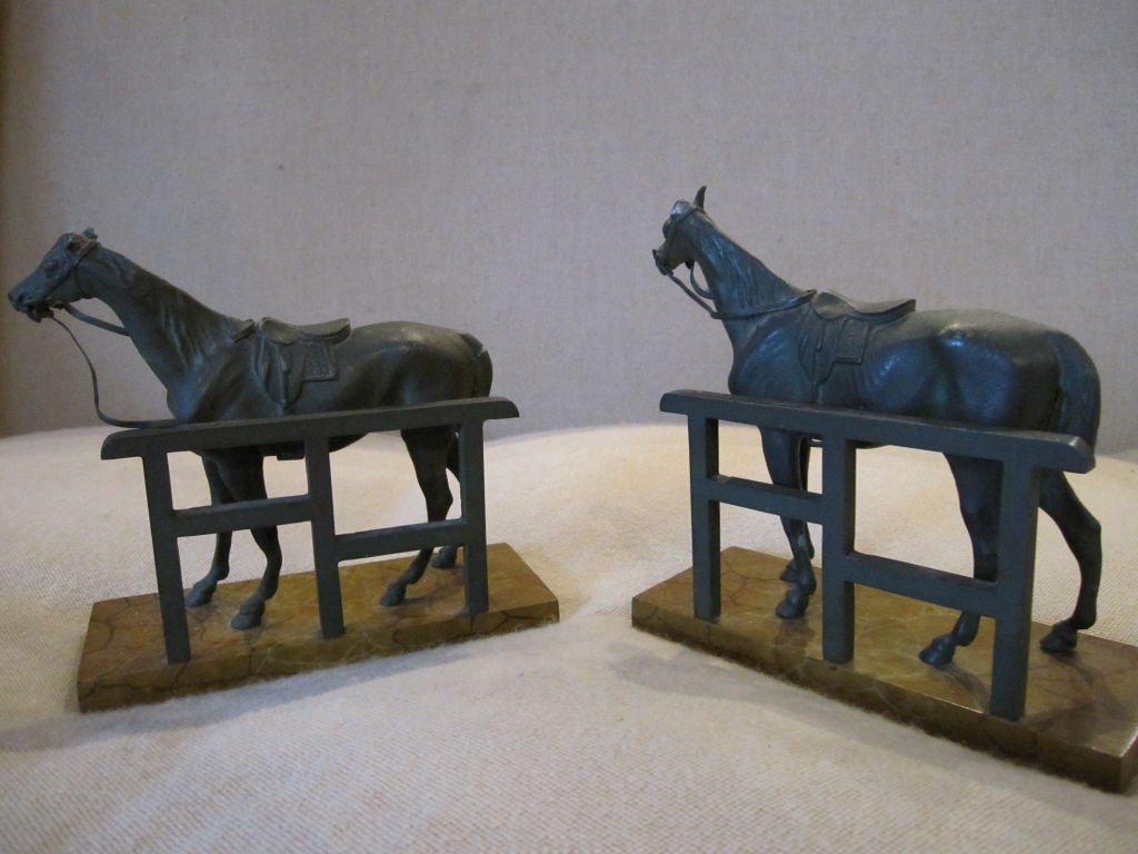 Cast metal horses with faux marble bases