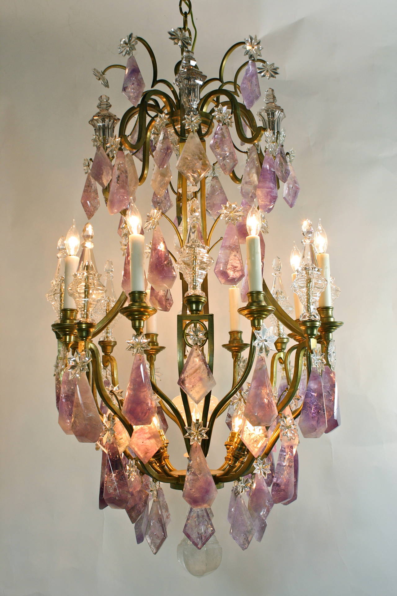 A rare French gilt-bronze chandelier with large, thick amethyst rock crystals, rock crystal inner spear and two rock crystal bals (circa 1900).  Eight spears decorate the arms, and four additional spears ornament the top. The chandelier is