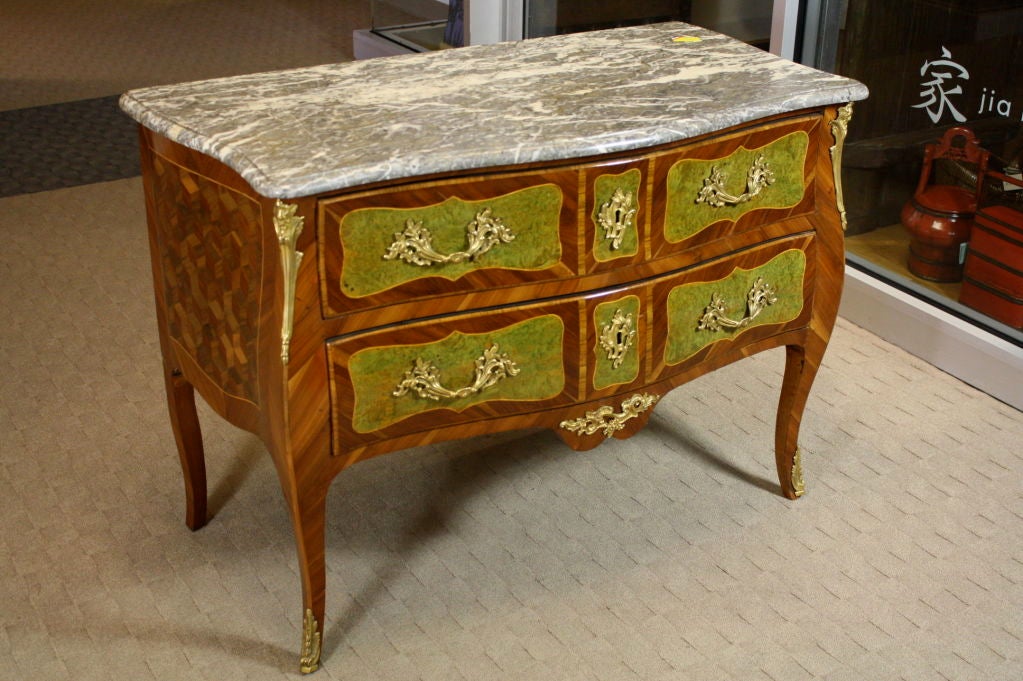 An unusual and very high quality Louis XV period commode with two drawers and elegant cabriole legs (also called a 