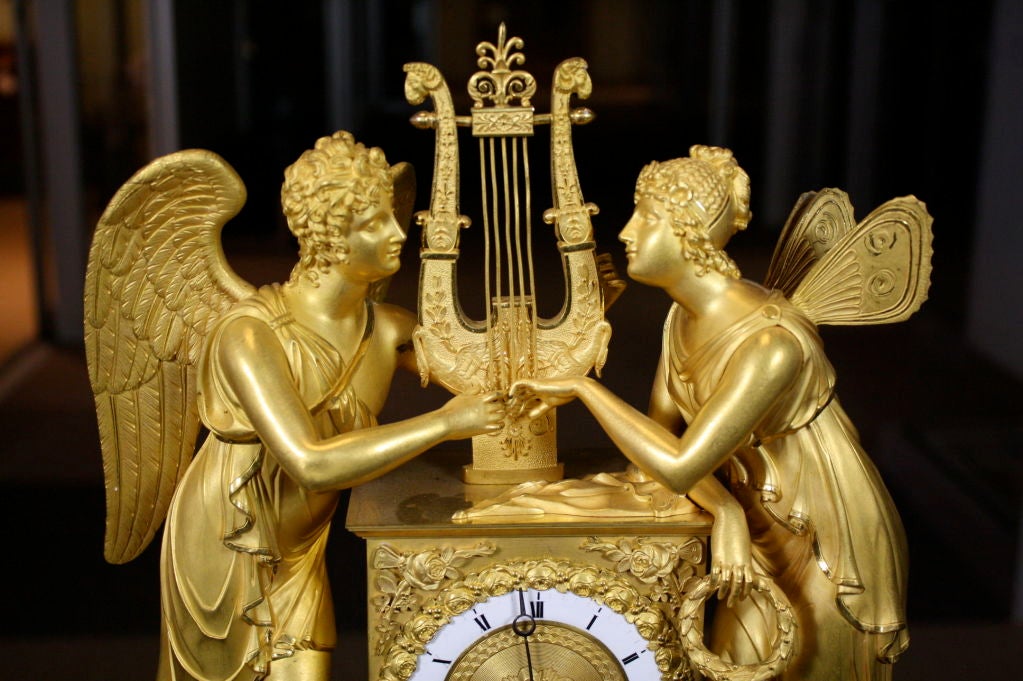 French Empire period gilt-bronze clock featuring Cupid, the son of Venus (also known as 